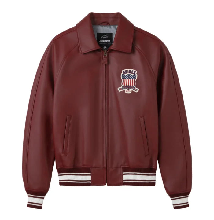 Front view of Avirex men’s maroon leather bomber with heritage chest shield, full zip and striped rib-knit trims