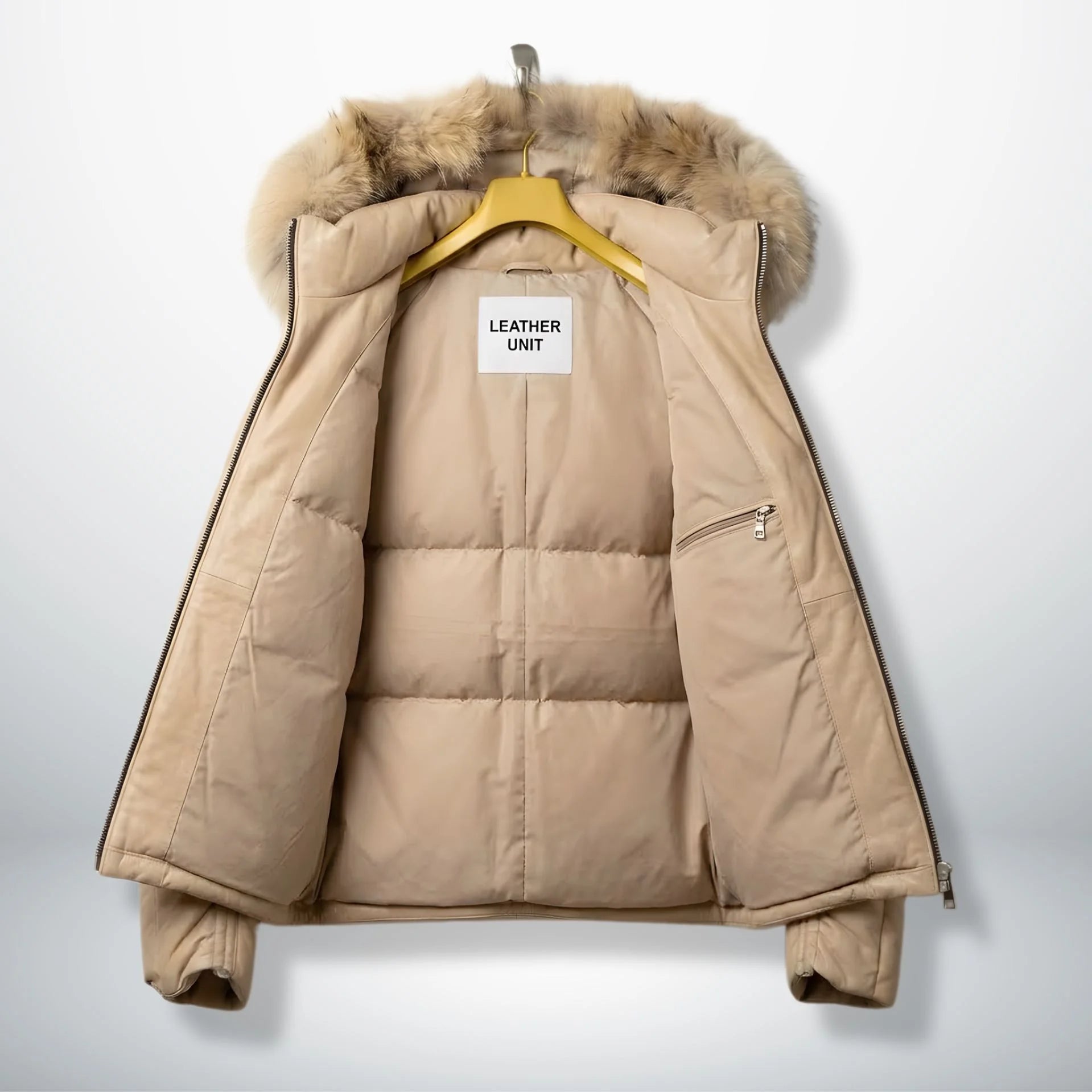 Inside view of beige leather puffer jacket with padded lining and inner zip pocket.