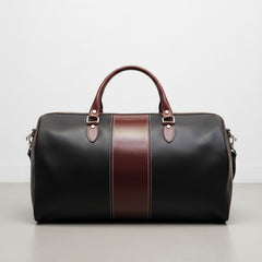 black leather duffle bag with brown center stripe and double handles.