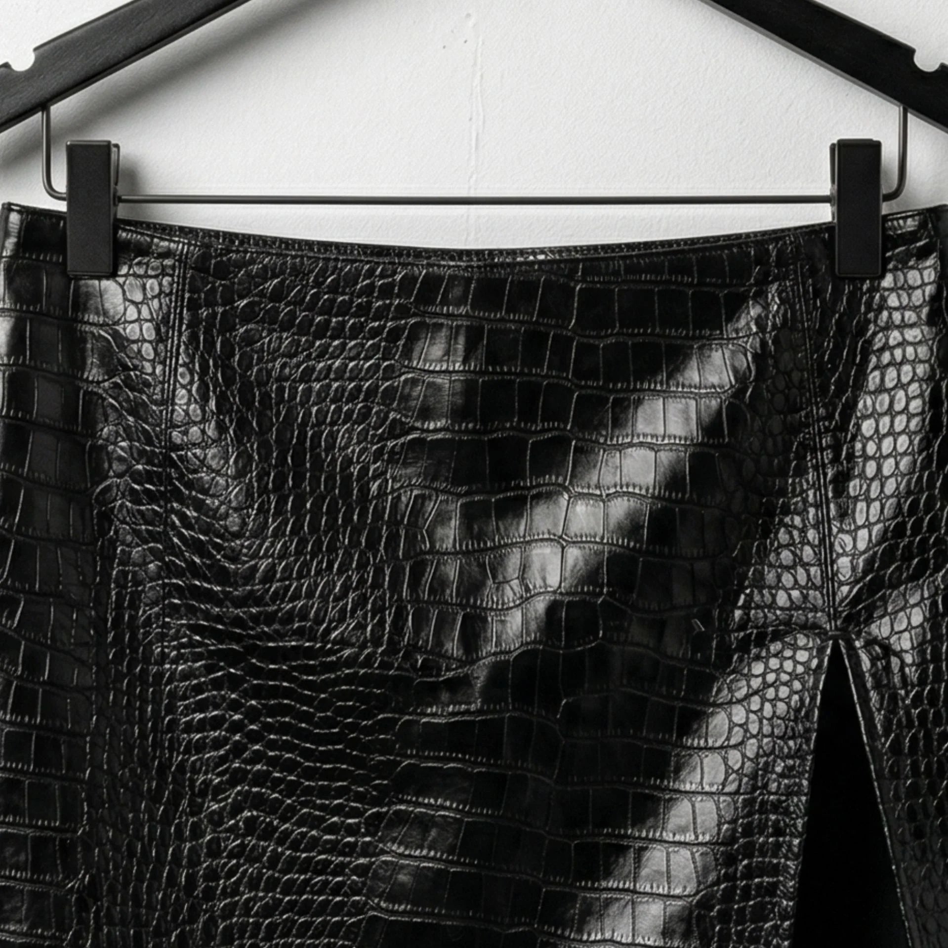 Close up of waistband and texture on black croc embossed leather skirt