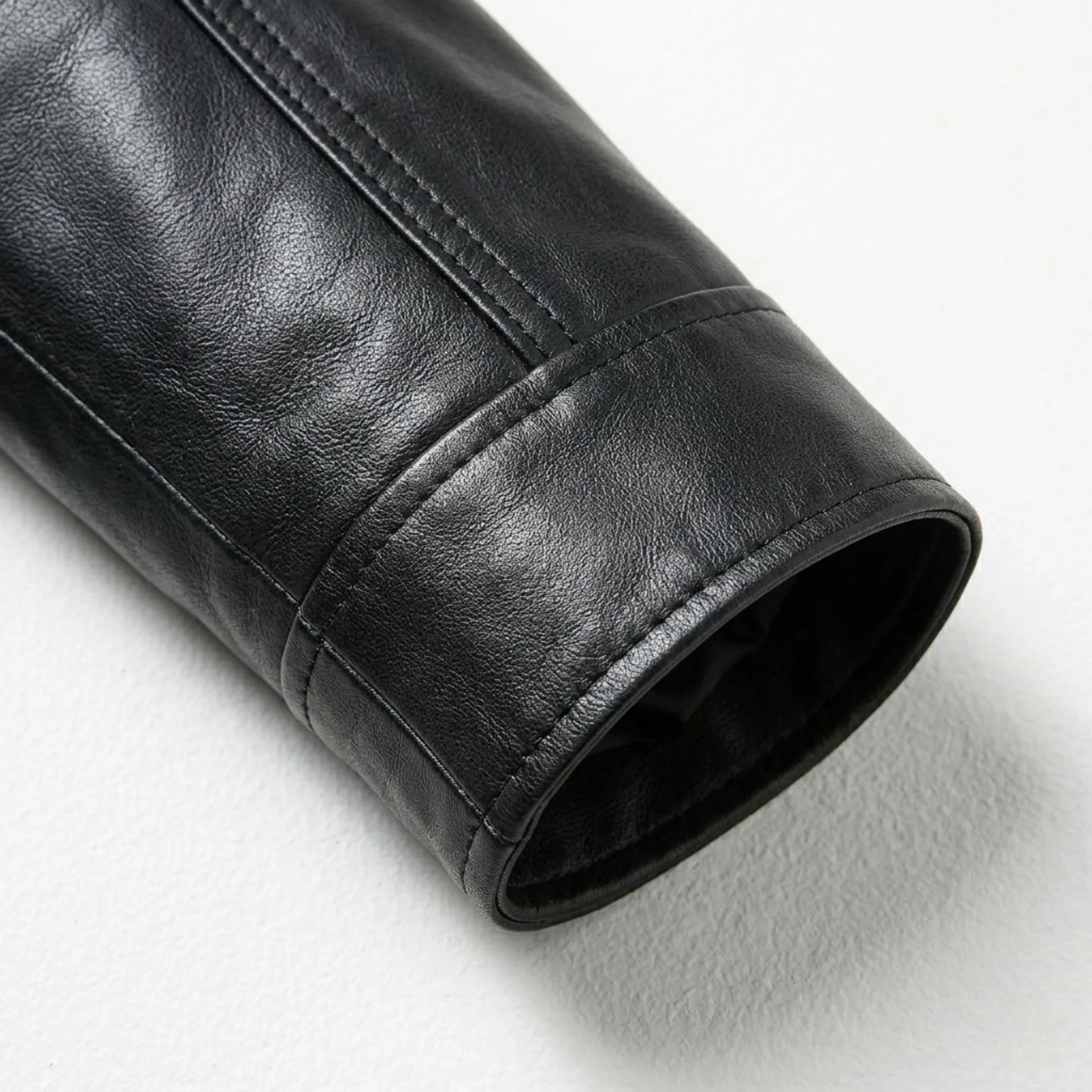 Close up of black leather jacket sleeve and cuff detail
