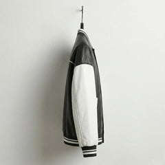 Side view of black and white baseball varsity leather jacket