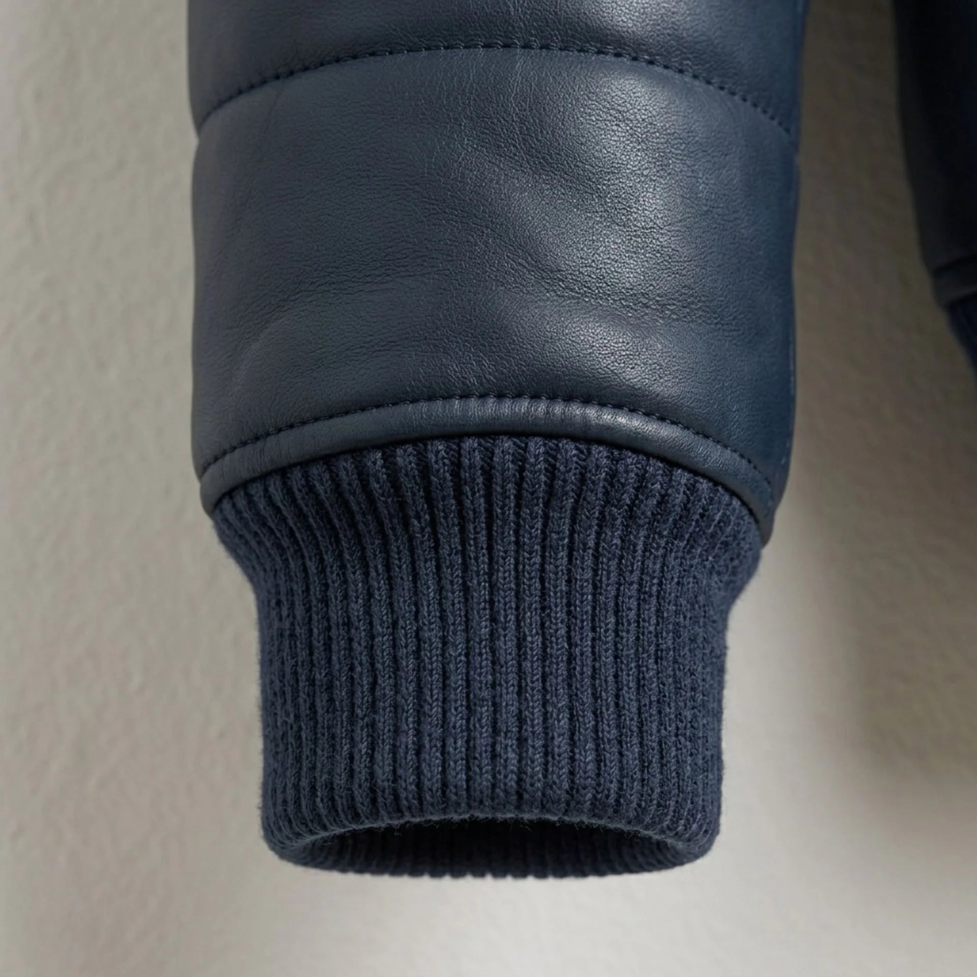 Detailed view of ribbed cuff and premium sheepskin texture