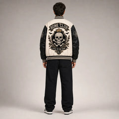 Back studio view of Bone Club varsity jacket with large crowned skull, crossbones, bats and Loyal to the Bone embroidery