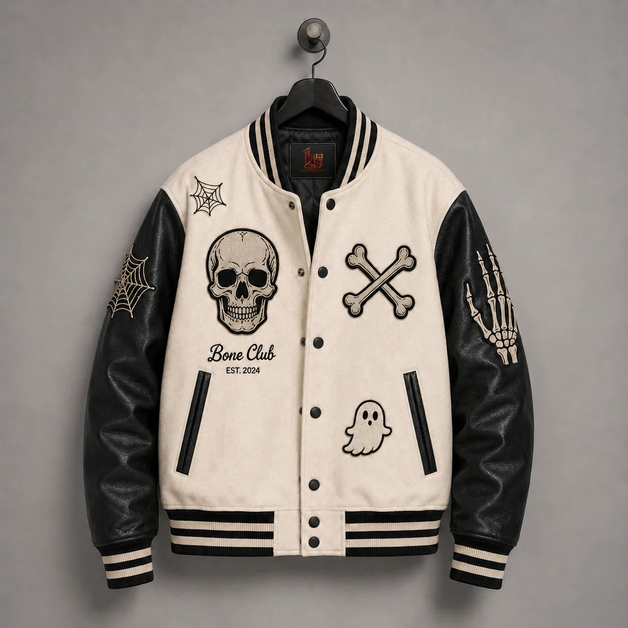 Front hanger view of Bone Club Halloween jacket with skull, crossbones, ghost, spider-web and skeleton-hand embroidery