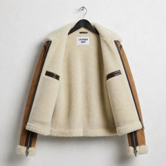 Interior cream sherpa lining of womens brown aviator shearling jacket
