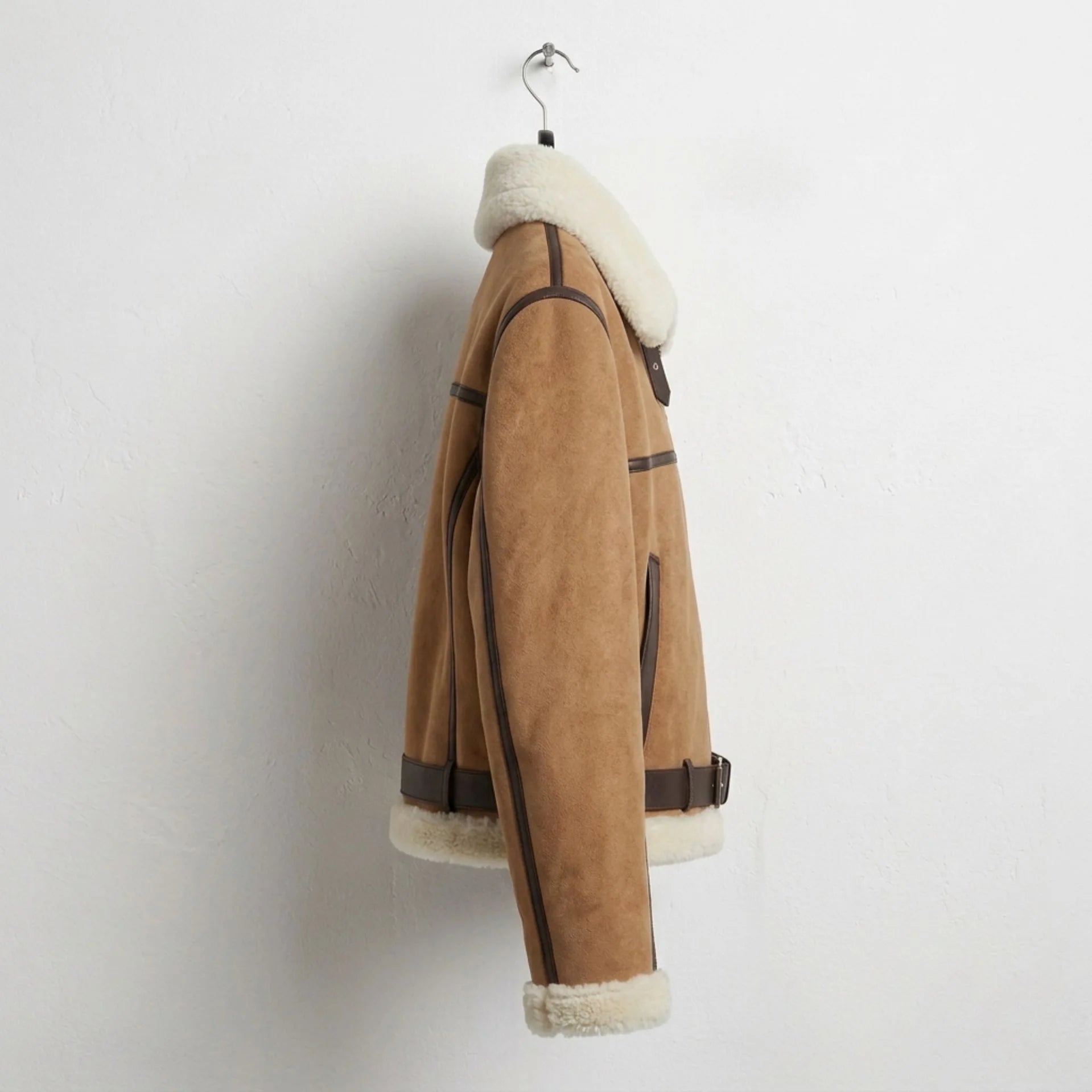 Side view of womens biscuit brown sherpa aviator leather jacket