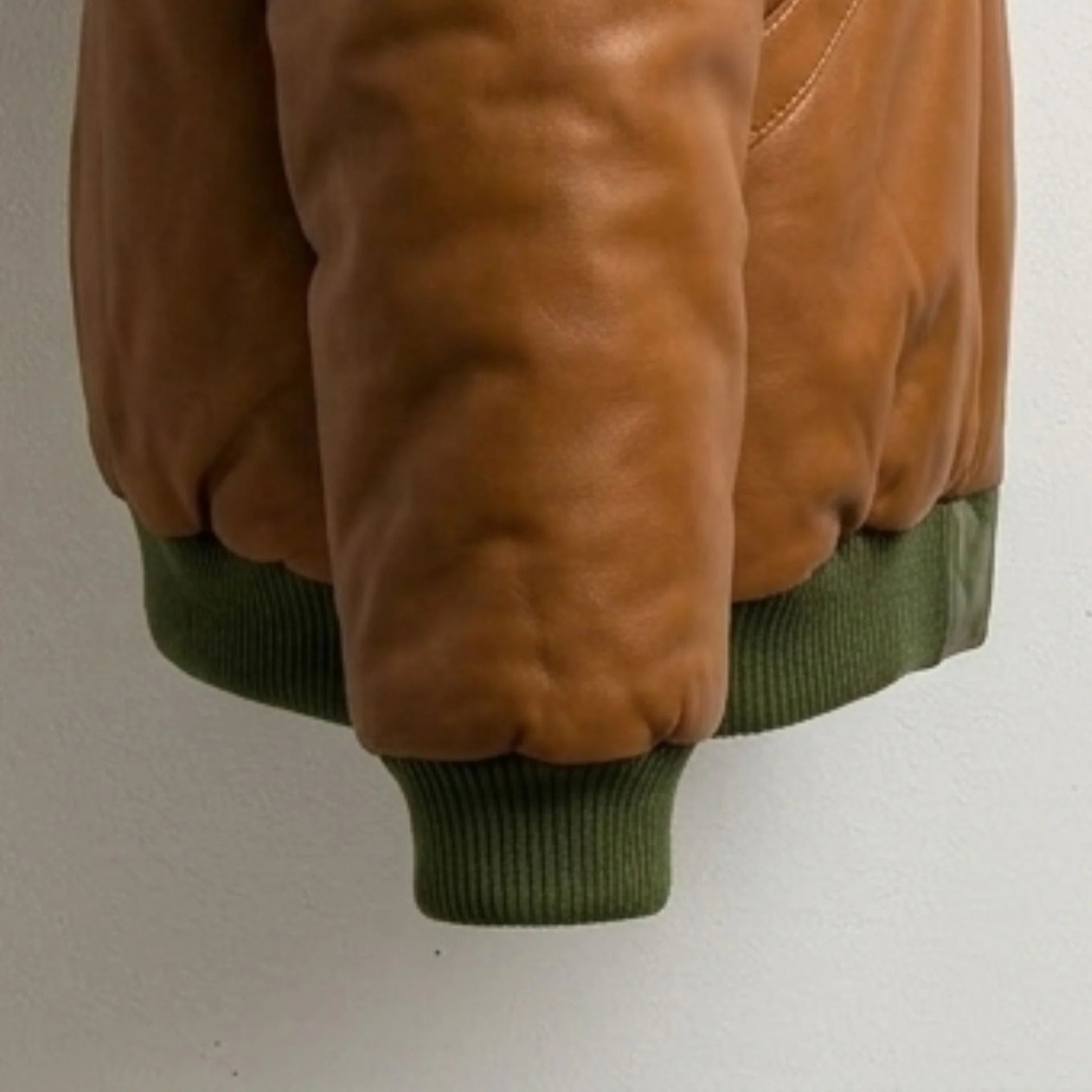 Detailed view of ribbed cuff and premium leather texture