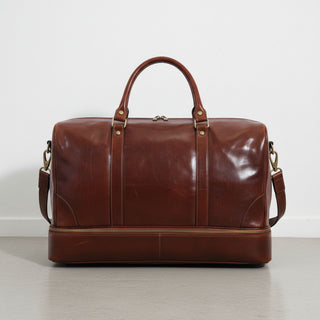 back view brown genuine leather travel duffle bag with detachable shoulder strap.