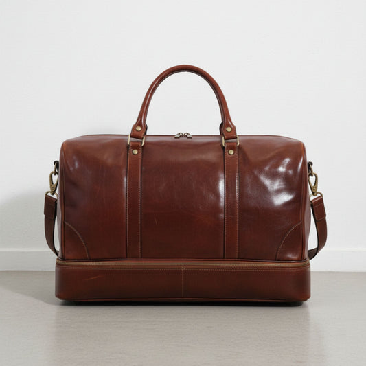 back view brown genuine leather travel duffle bag with detachable shoulder strap.