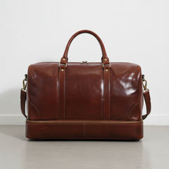 back view brown genuine leather travel duffle bag with detachable shoulder strap.