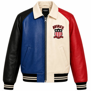 Front view of cream blue red and black color block leather varsity jacket with full zip and embroidered chest crest