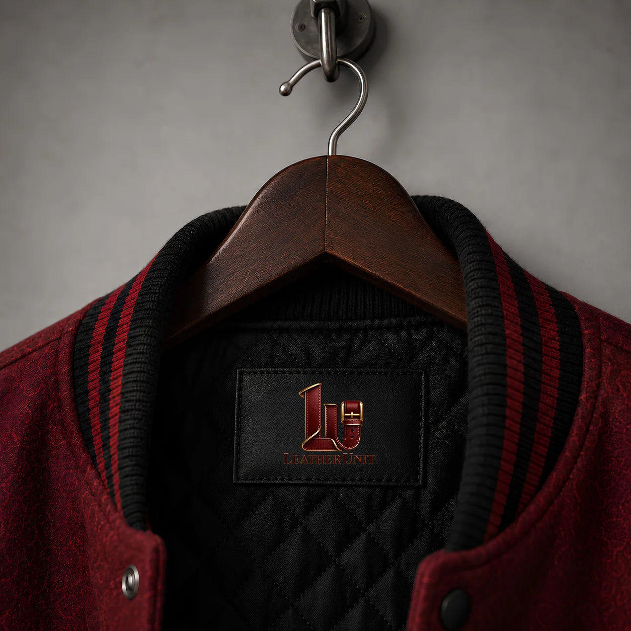 Close-up of Crimson Manor Halloween Varsity Jacket collar, quilted lining and Leather Unit label