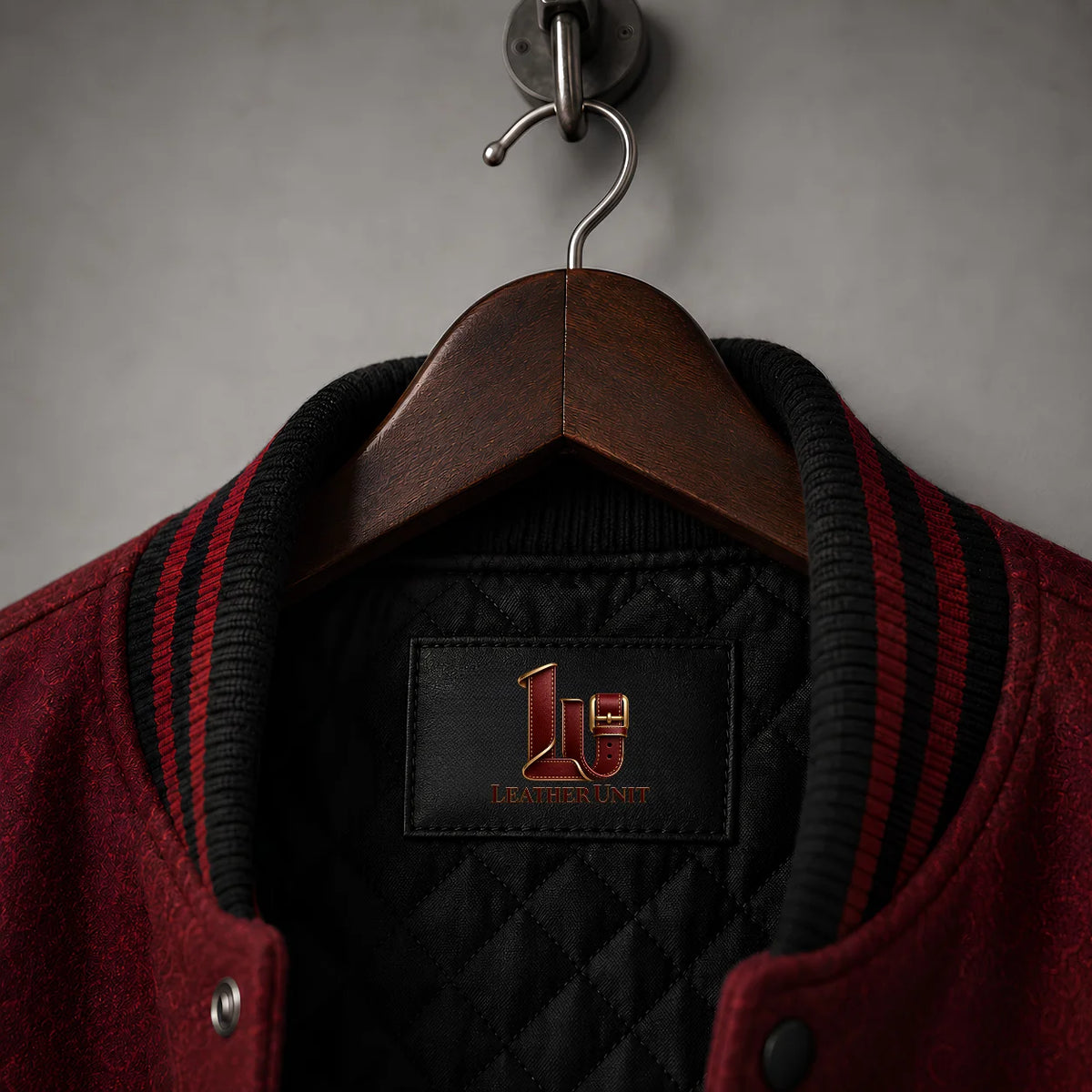 Close-up of Crimson Manor Halloween Varsity Jacket collar, quilted lining and Leather Unit label
