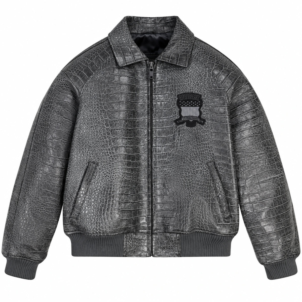 Front view of dark grey textured leather bomber jacket with zip fastening, angled pockets and chest emblem
