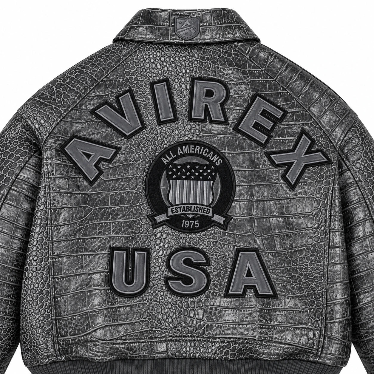 Close-up of grey crocodile-textured leather jacket back showing raised USA lettering and central shield emblem