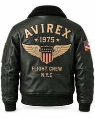 Back view of dark green flight bomber jacket with large winged shield graphic, 1975 lettering and ribbed waistband