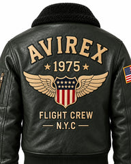 Close-up of olive bomber jacket back featuring winged USA-style shield, Flight Crew lettering and textured finish