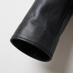 Detail of genuine black leather sleeve on women’s jacket