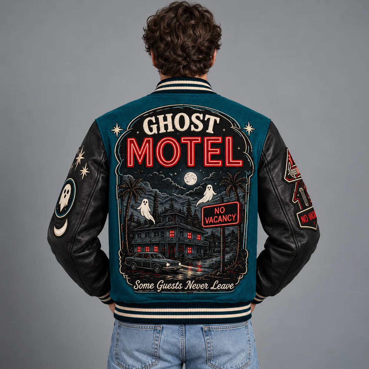 Back model view of Ghost Motel Halloween jacket with haunted motel, ghosts, full moon and No Vacancy artwork