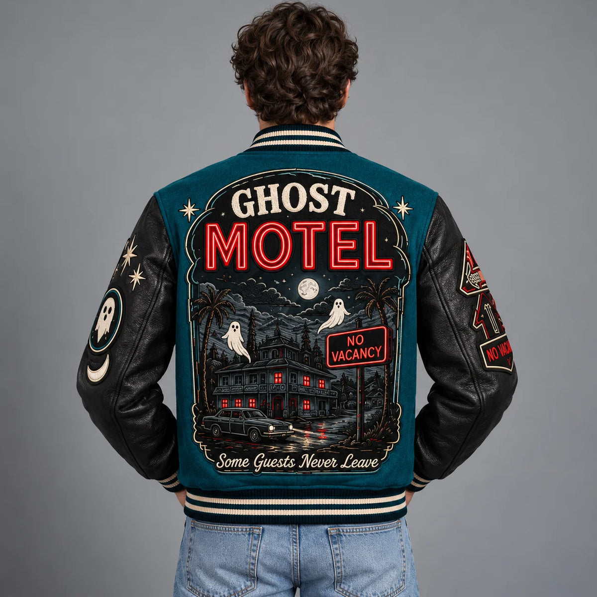 Back model view of Ghost Motel Halloween jacket with haunted motel, ghosts, full moon and No Vacancy artwork