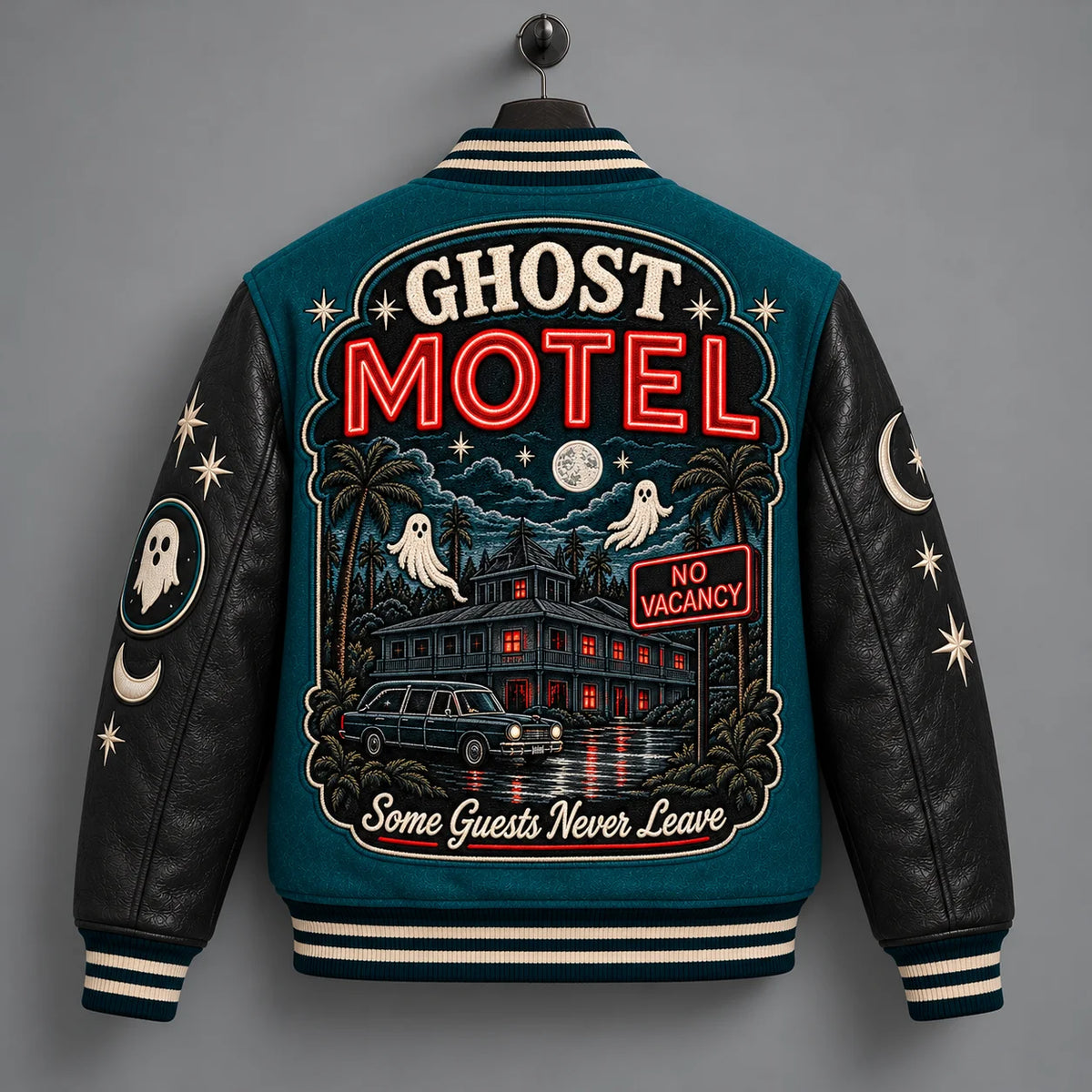 Back hanger view of Ghost Motel varsity jacket with haunted hotel scene, ghosts, car and red No Vacancy sign