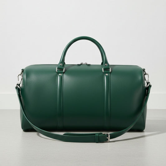 green leather duffle bag with detachable shoulder strap and silver hardware.