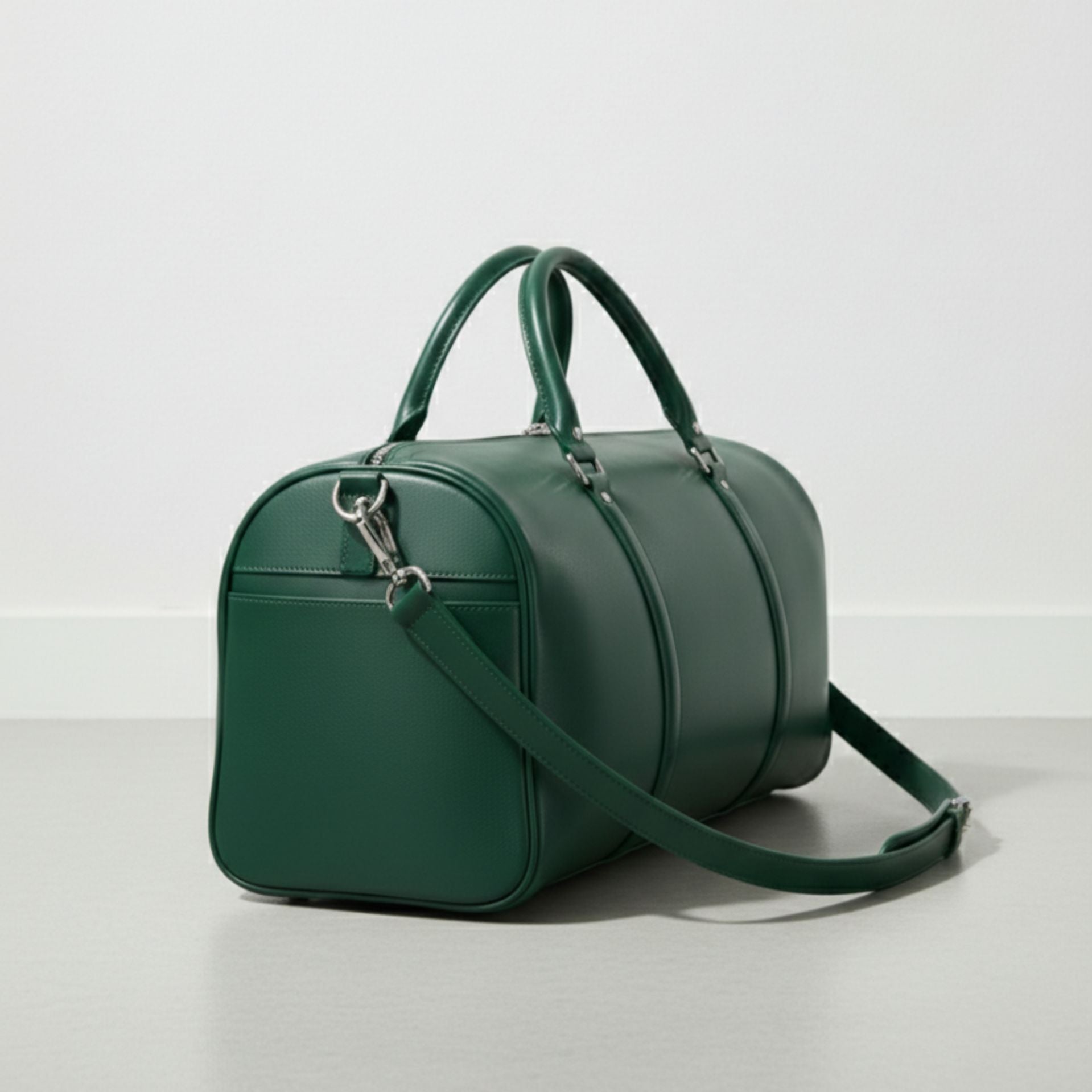 side angle of green leather weekender bag showing exterior slip pocket.