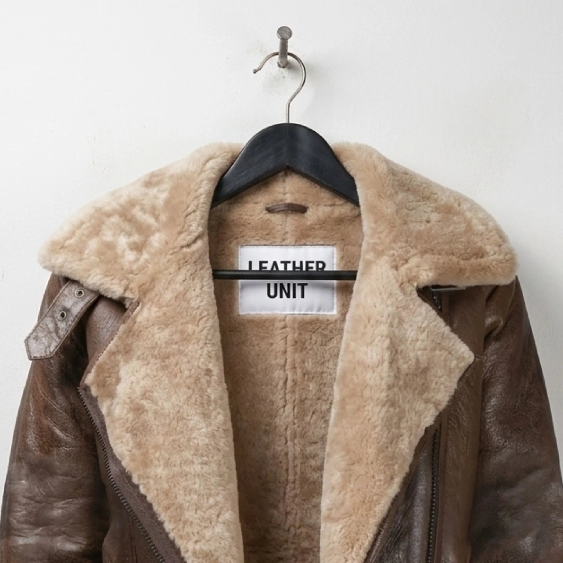 Close-up of shearling collar and label on Leather Unit B3 bomber jacket