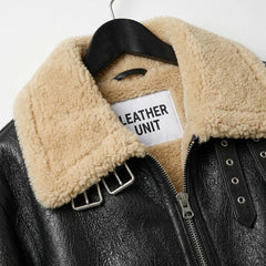 Women’s black aviator shearling leather jacket with beige fur collar and hem by Leather Unit