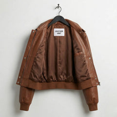 Inside lining of women’s brown cropped leather bomber jacket with inner pocket