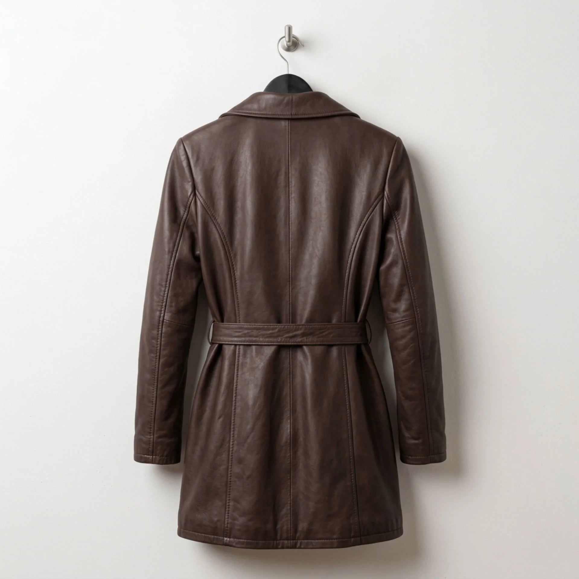Back view of mid length brown leather coat with waist belt