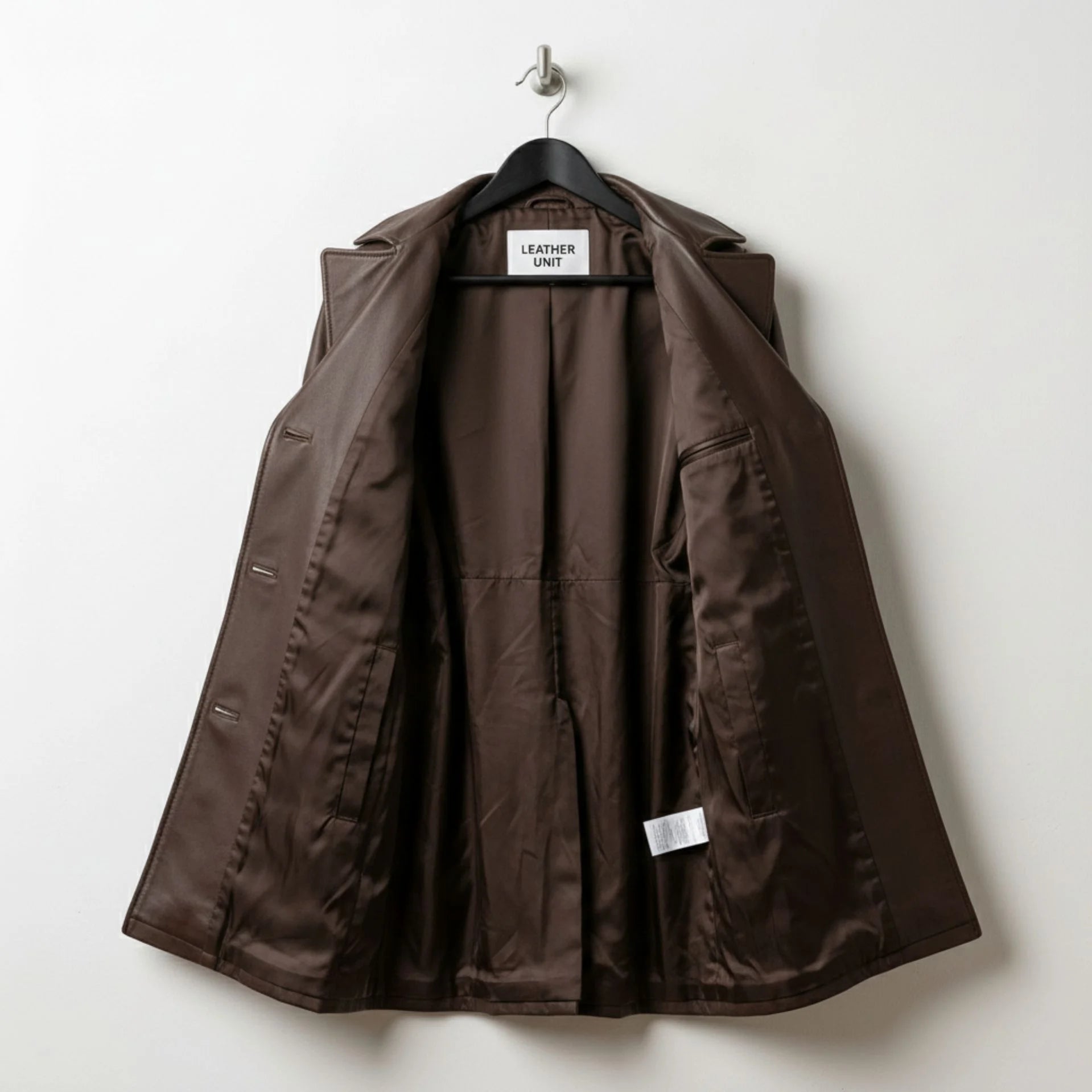 Inside lining of women’s brown leather coat showing full brown interior