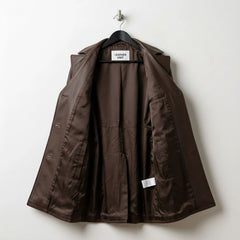 Inside lining of women’s brown leather coat showing full brown interior