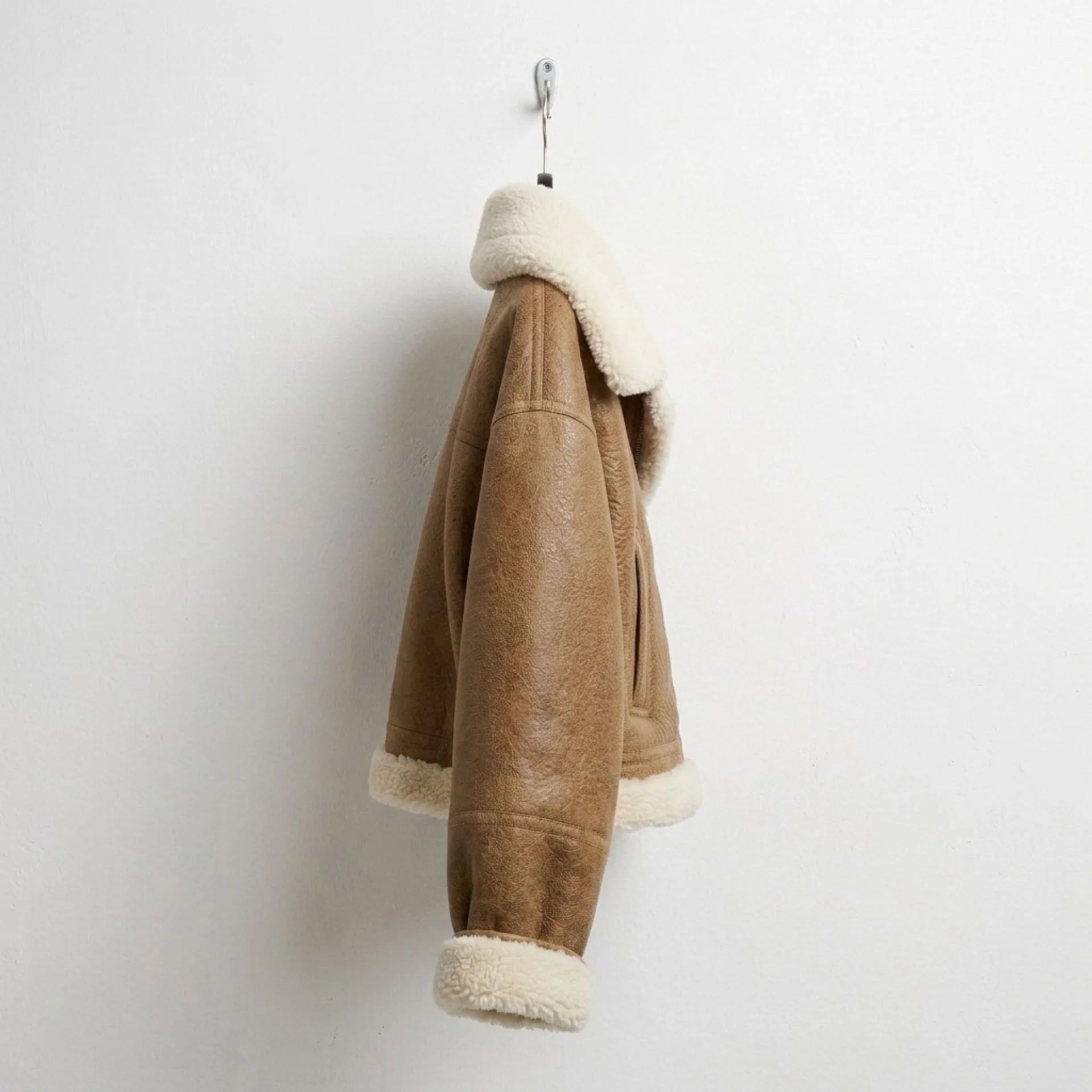 Right side of Women’s brown cropped shearling aviator jacket
