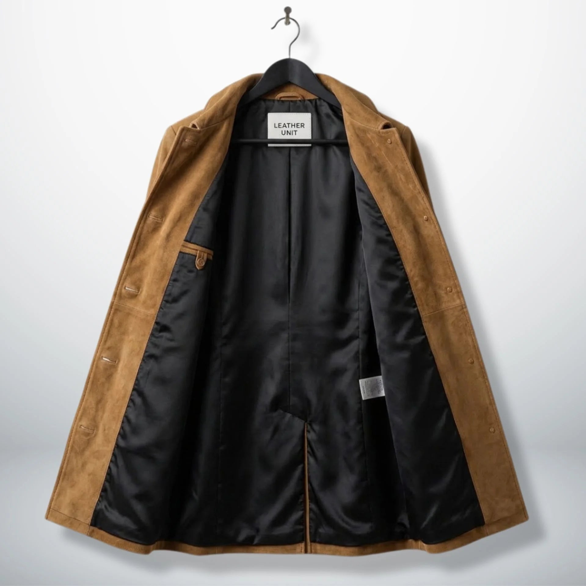 Inside lining of camel brown suede coat showing black interior