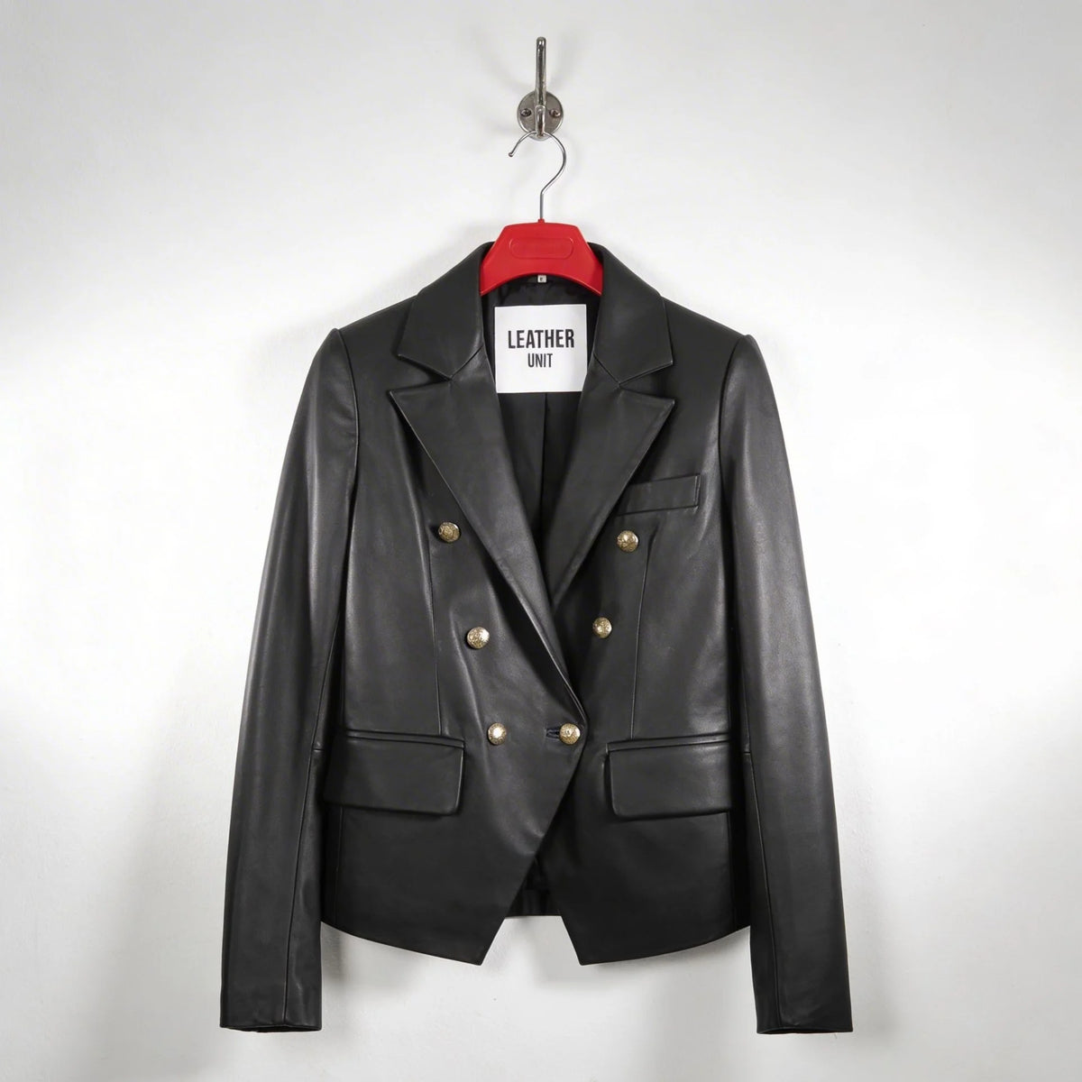 Front view of women’s double breasted black leather blazer with gold buttons by Leather Unit