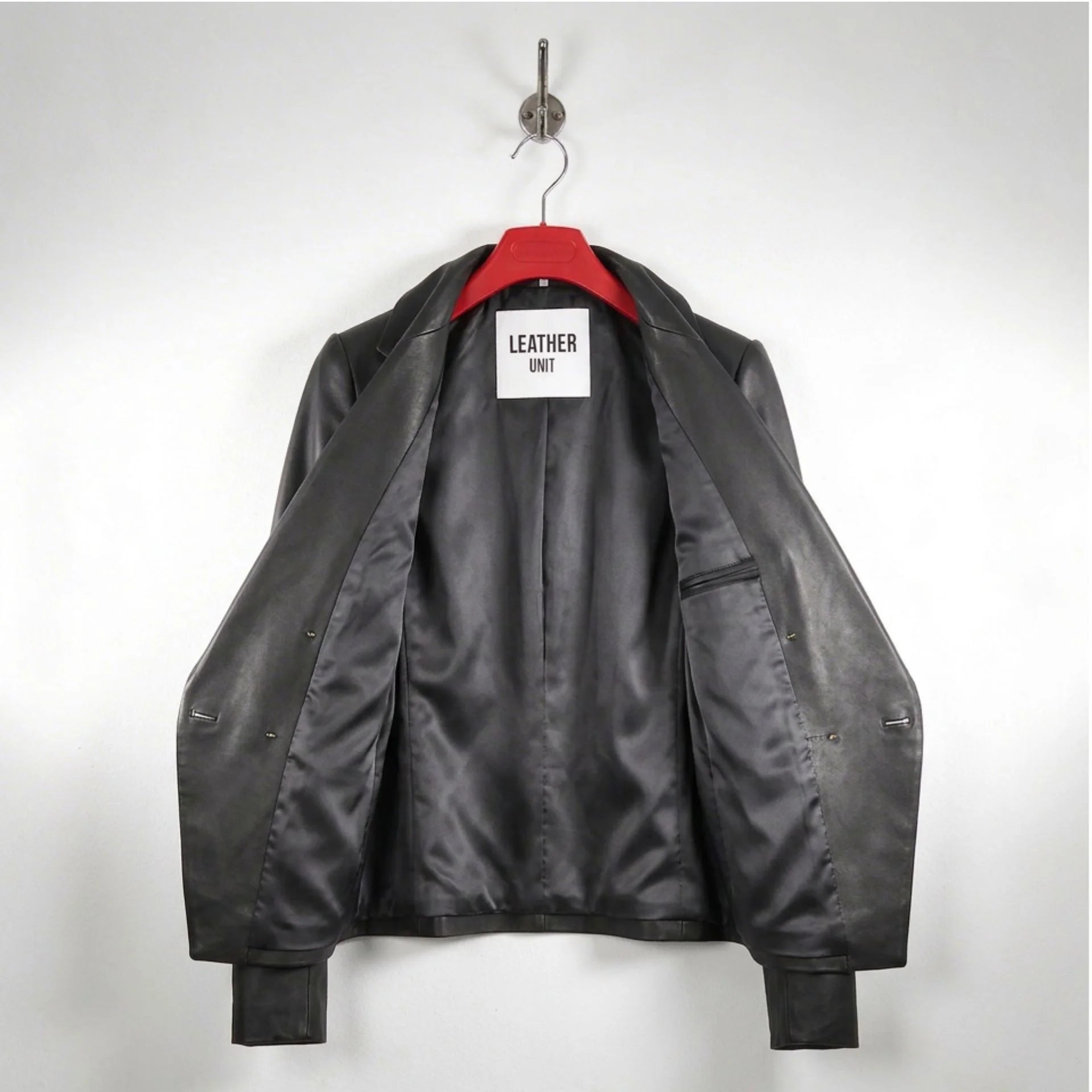 Inside lining of women’s black leather blazer showing interior pocket
