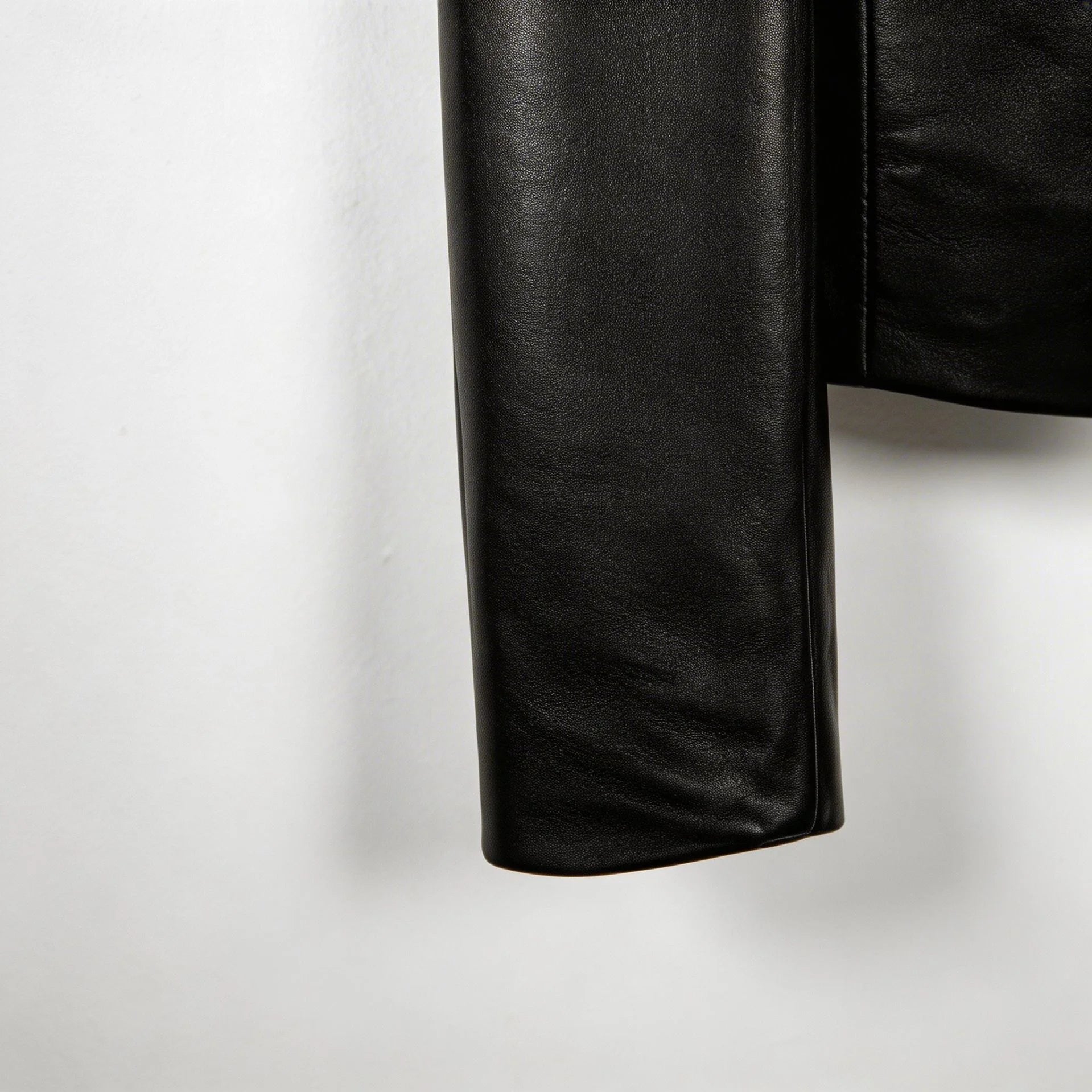 Sleeve cuff detail on smooth genuine black leather blazer