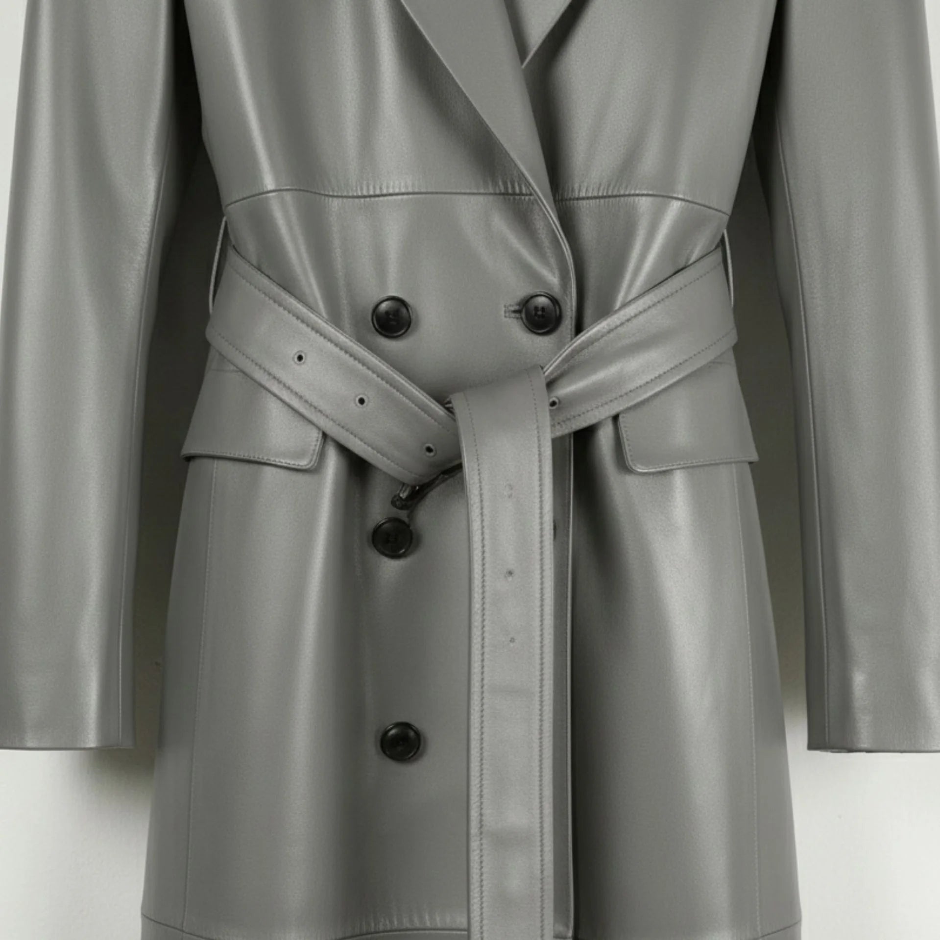 Belted waist and double breasted buttons on long grey leather coat