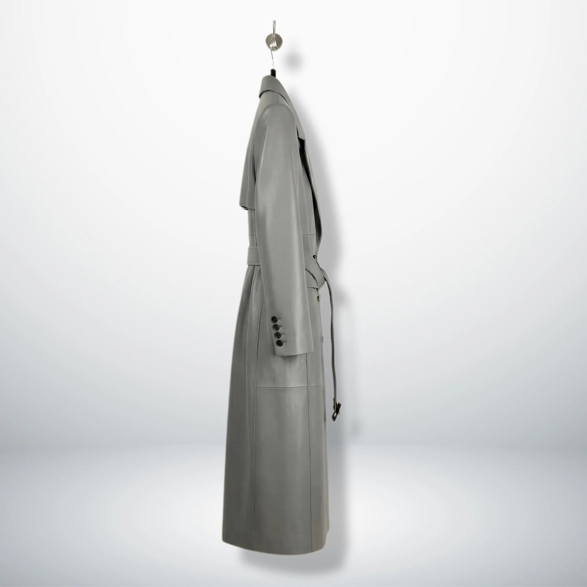 Inside lining of grey leather trench coat showing black interior and vent