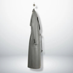 Inside lining of grey leather trench coat showing black interior and vent