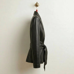 Side profile of fitted hip‑length black belted leather blazer for women
