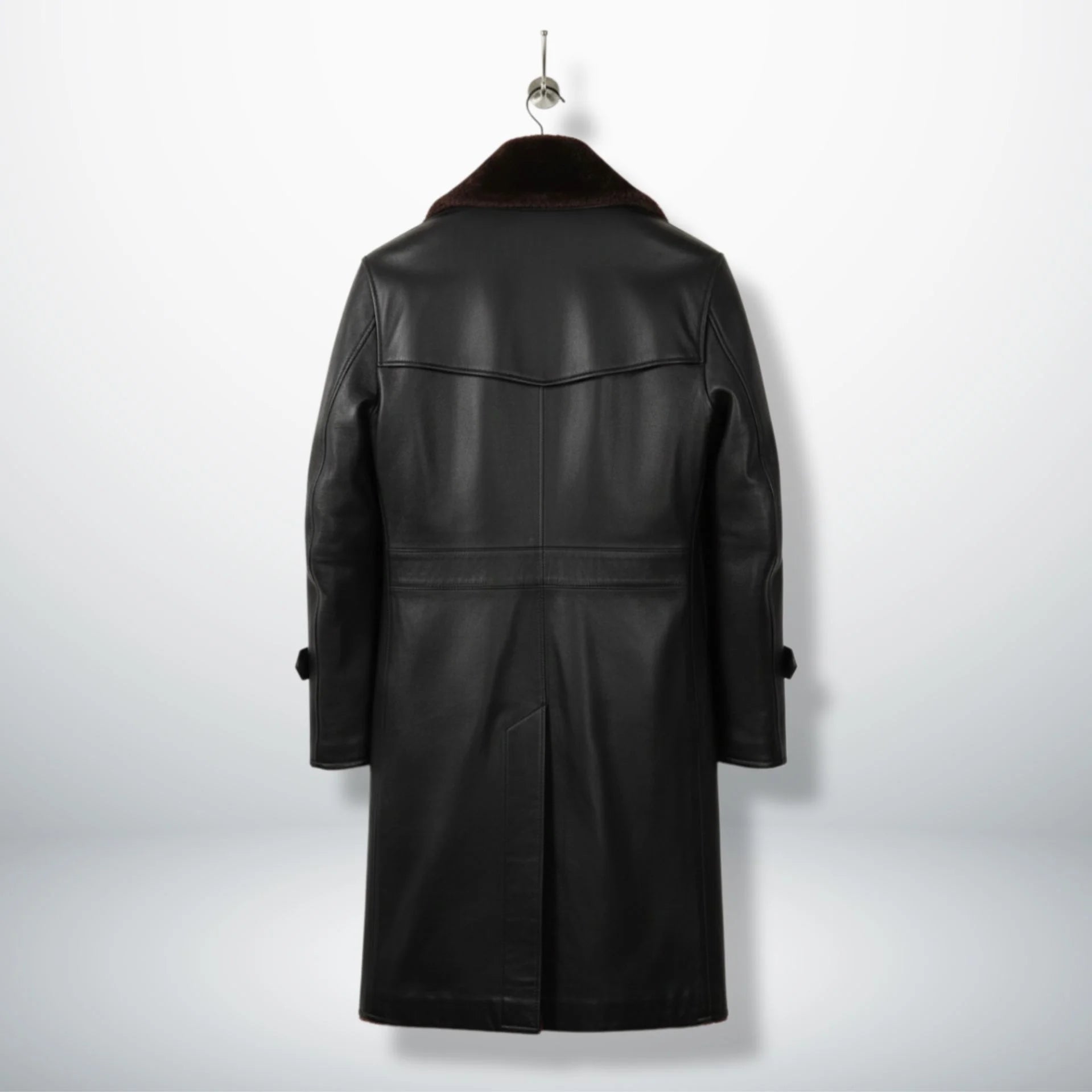 Back view of long black leather shearling coat with yoke detail