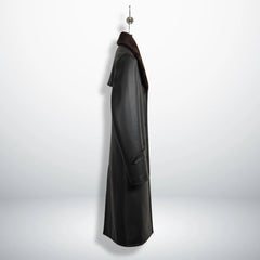 Side profile of men’s black shearling leather overcoat showing length