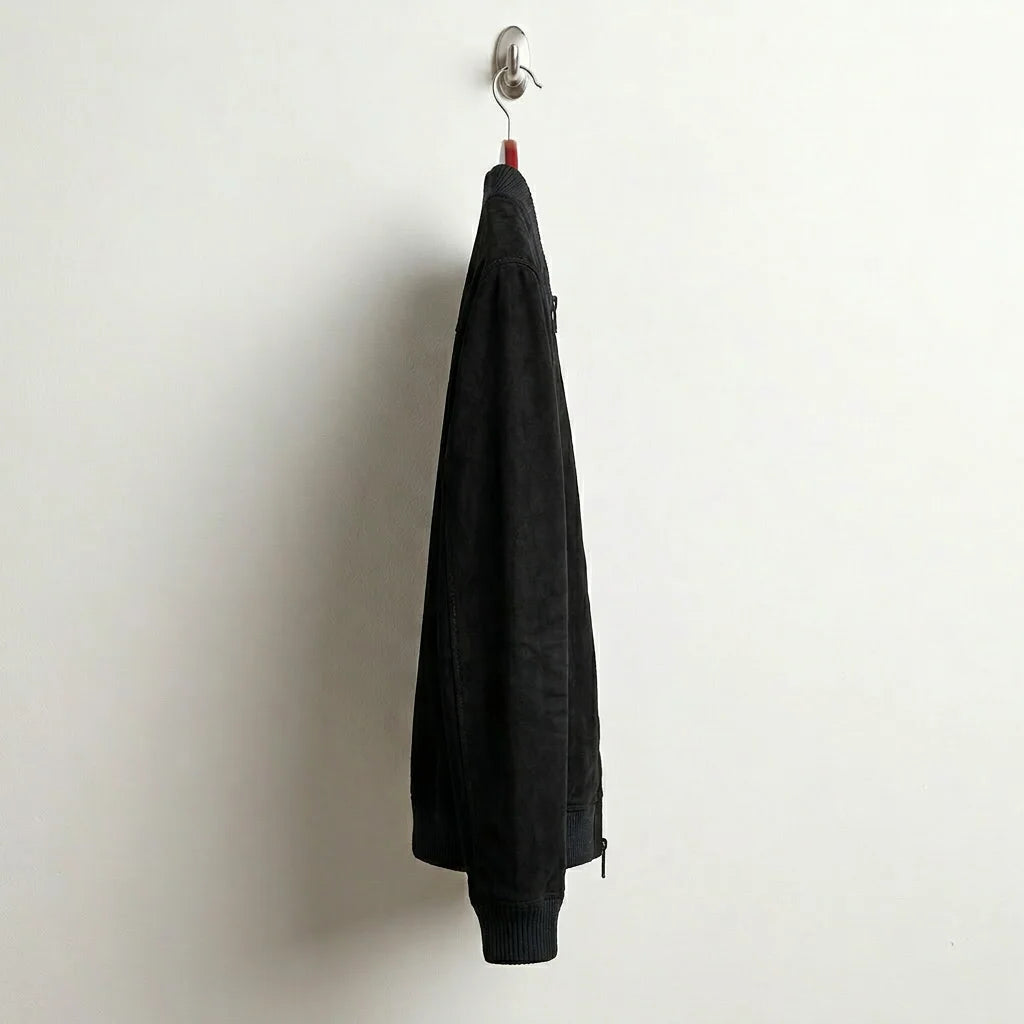 Side profile of men's slim fit black suede bomber jacket
