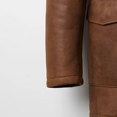Sleeve and cuff detail on men’s brown genuine leather shearling coat