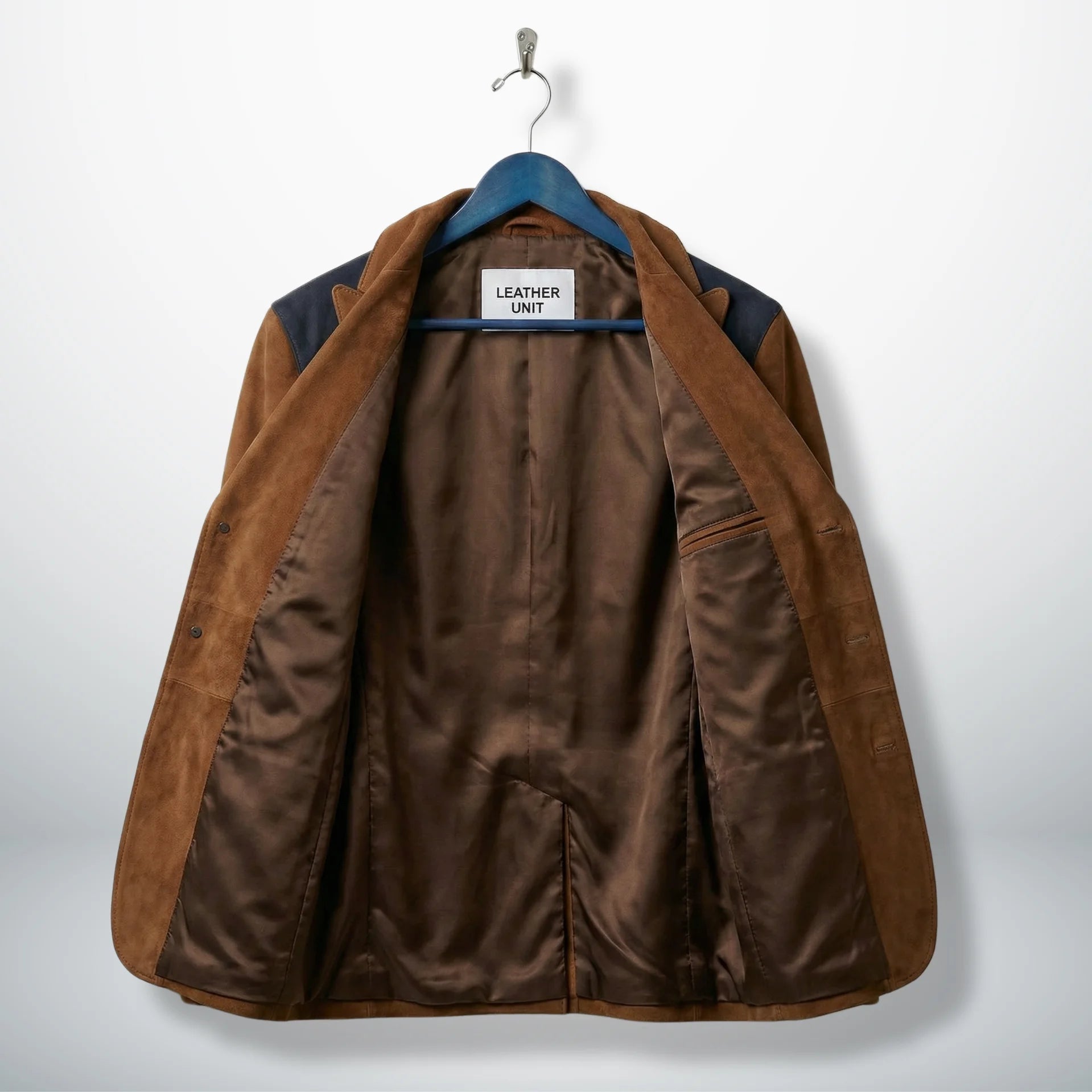Inside lining of men’s brown suede western blazer showing inner pockets