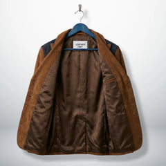 Inside lining of men’s brown suede western blazer showing inner pockets