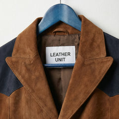 Close up of notch lapel and Leather Unit label on brown suede blazer